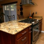 Giallo Beach granite installed over brown cabinets