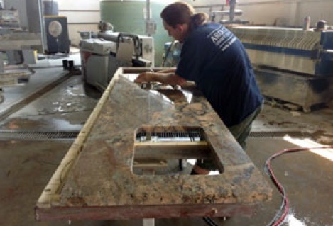 Skilled stone fabricators do the final polish and quality inspection