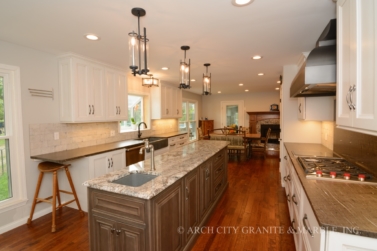Two-tone kitchen with two different granite colors in a st. louis home