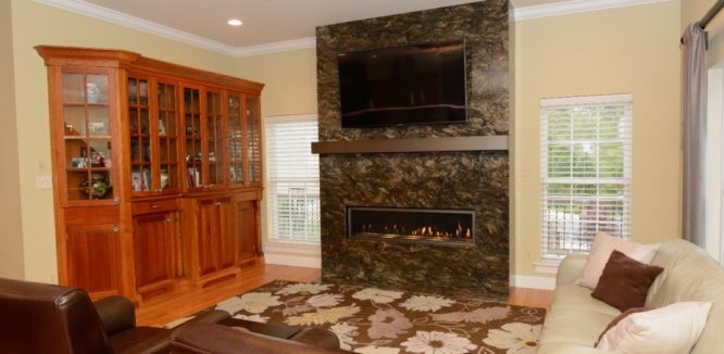 Floor-to-Ceiling Stone Fireplace Surrounds