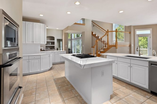 Kitchen with white quartz countertops