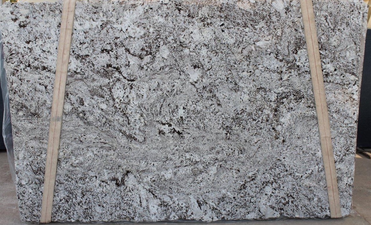 Alaska White Granite slab - Granite with White background and brown, grey, and black specks