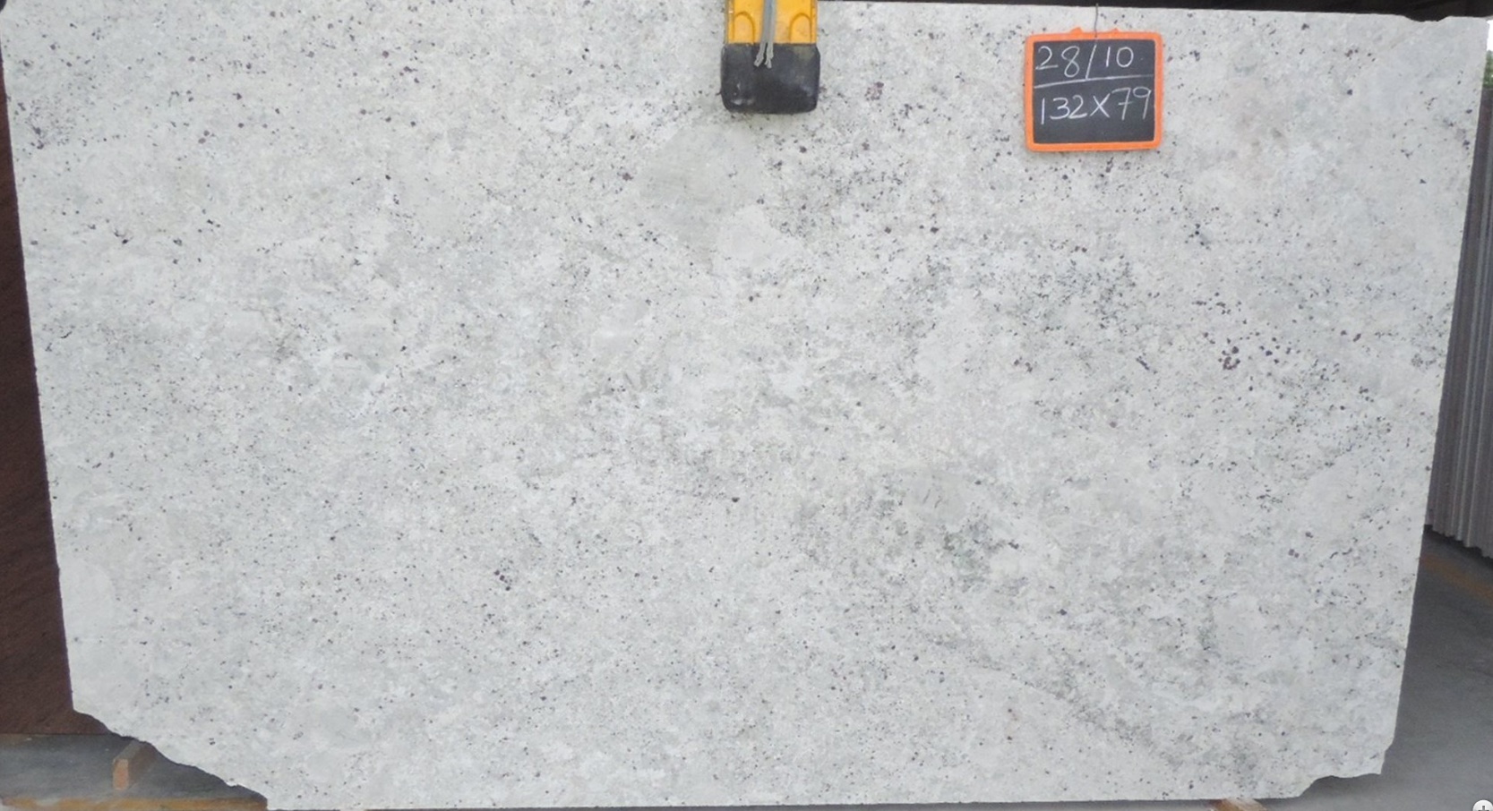 Colonial White - A white granite from India with creamy off-white background mixed with black and garnet speckles