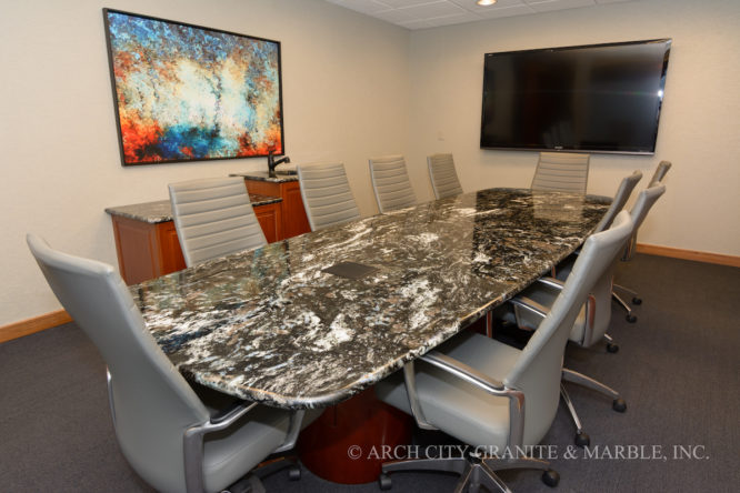Office conference table fabricated with Brazilian granite that accommodates 10 office chairs in a St. Louis corporate office