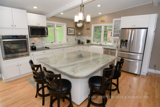 Missouri kitchen with Quartzite countertop island with extended overhang to accommodate dining chairs