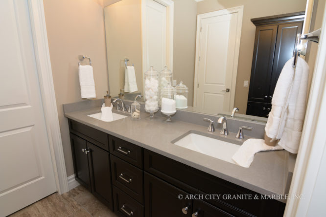 Grey colored Quartz Countertops in st. louis area paired with Espresso cabinetry for the master bath vanity top