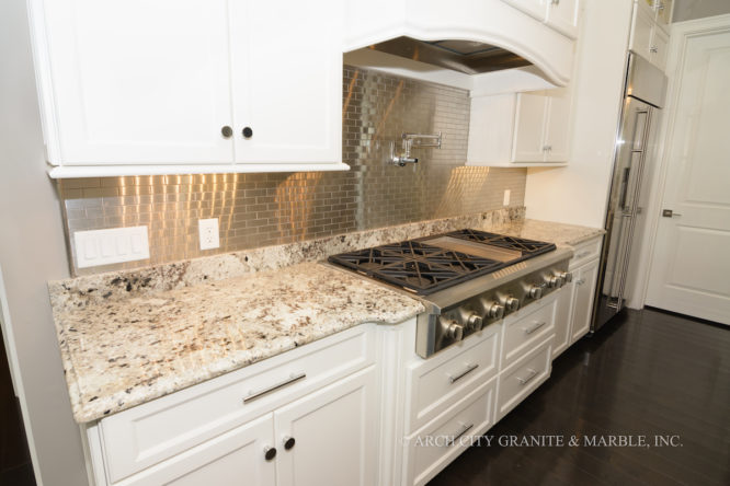 Granite countertops with bump outs to accommodate the range top installed in Lake St. Louis, MO