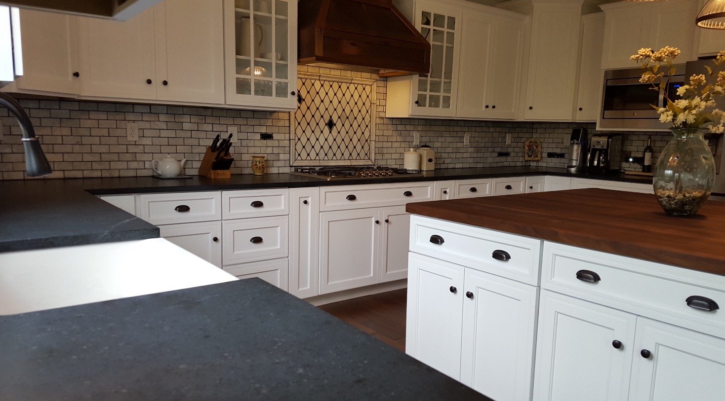 White Kitchen With Dark Granite Countertops 